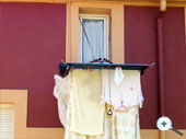 Tendedero y  cubre ropa instalacion en ventana estrecha